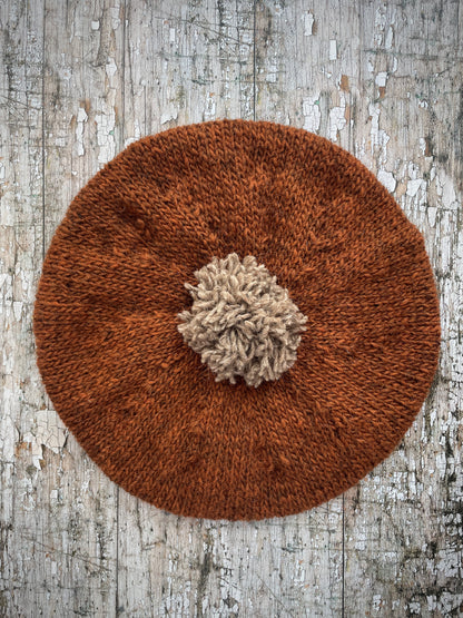 Hand Knitted Wool Beret Paprika + Dark Oat

Beautifully hand knitted beret in Icelandic pure wool, perfect for keeping your head warm on cold days, knitted in paprika with a dark oat colour pom and ribbed band that gives the hat a snug fit.

SIZE: adult.

DIAMETER: 11+1/4" / 28.5 cm.

CARE: hand wash or machine wash on wool cycle at 30 degrees, dry flat, do not tumble dry.