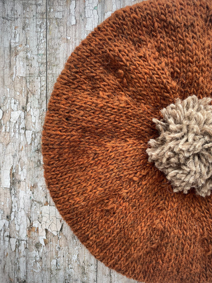 Hand Knitted Wool Beret Paprika + Dark Oat

Beautifully hand knitted beret in Icelandic pure wool, perfect for keeping your head warm on cold days, knitted in paprika with a dark oat colour pom and ribbed band that gives the hat a snug fit.

SIZE: adult.

DIAMETER: 11+1/4" / 28.5 cm.

CARE: hand wash or machine wash on wool cycle at 30 degrees, dry flat, do not tumble dry.