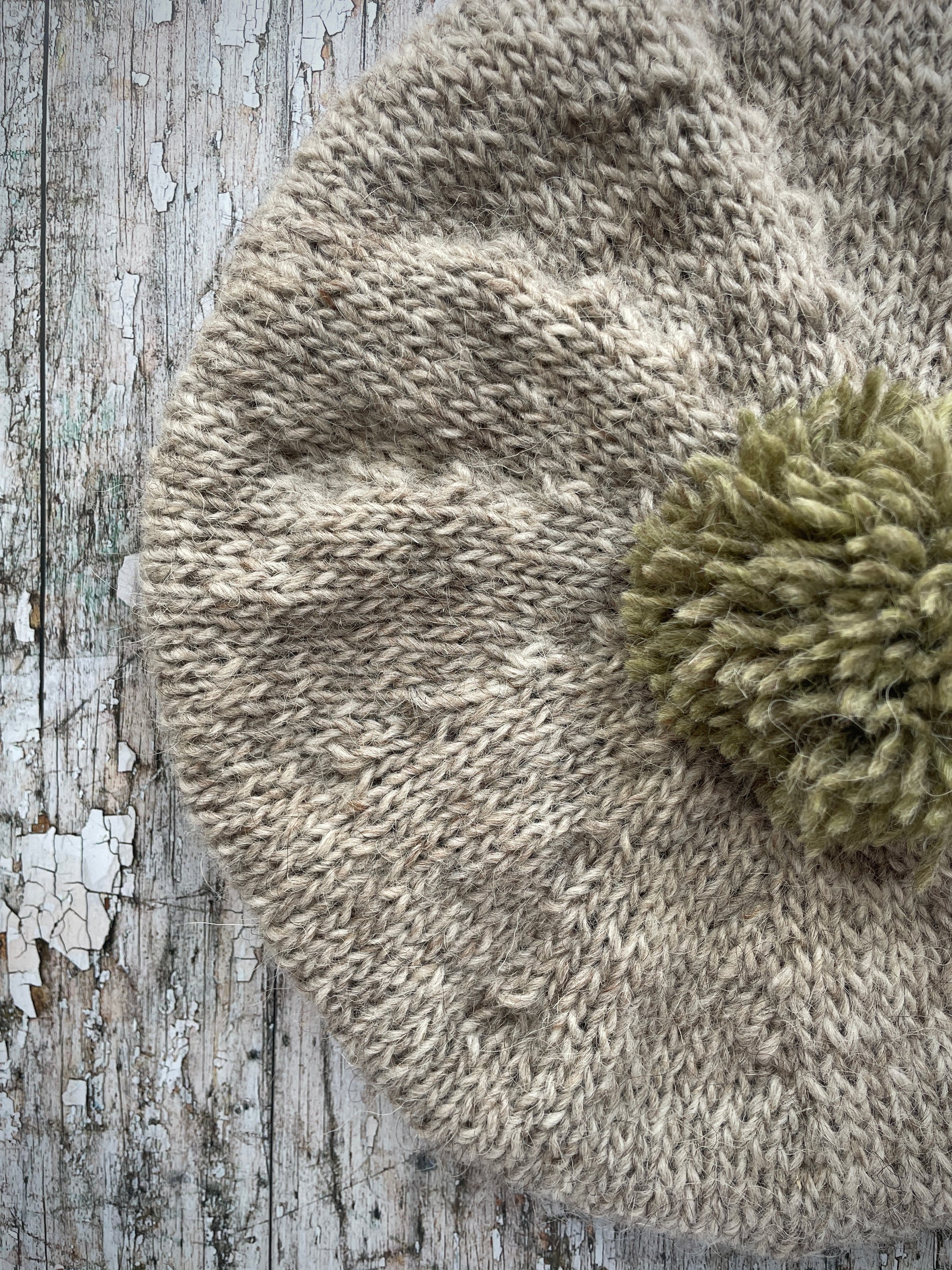 Hand Knitted Wool Beret Oat + Frosted Grass

Beautifully hand knitted beret in Icelandic pure wool, perfect for keeping your head warm on cold days, knitted in oat with a frosted grass colour pom and ribbed band that gives the hat a snug fit.

SIZE: adult.

DIAMETER: 11+1/4" / 29cm.

CARE: hand wash or machine wash on wool cycle at 30 degrees, dry flat, do not tumble dry.