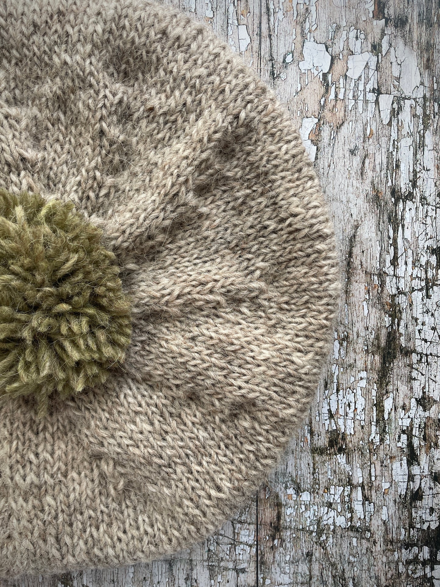 Hand Knitted Wool Beret Oat + Frosted Grass

Beautifully hand knitted beret in Icelandic pure wool, perfect for keeping your head warm on cold days, knitted in oat with a frosted grass colour pom and ribbed band that gives the hat a snug fit.

SIZE: adult.

DIAMETER: 11+1/4" / 29cm.

CARE: hand wash or machine wash on wool cycle at 30 degrees, dry flat, do not tumble dry.