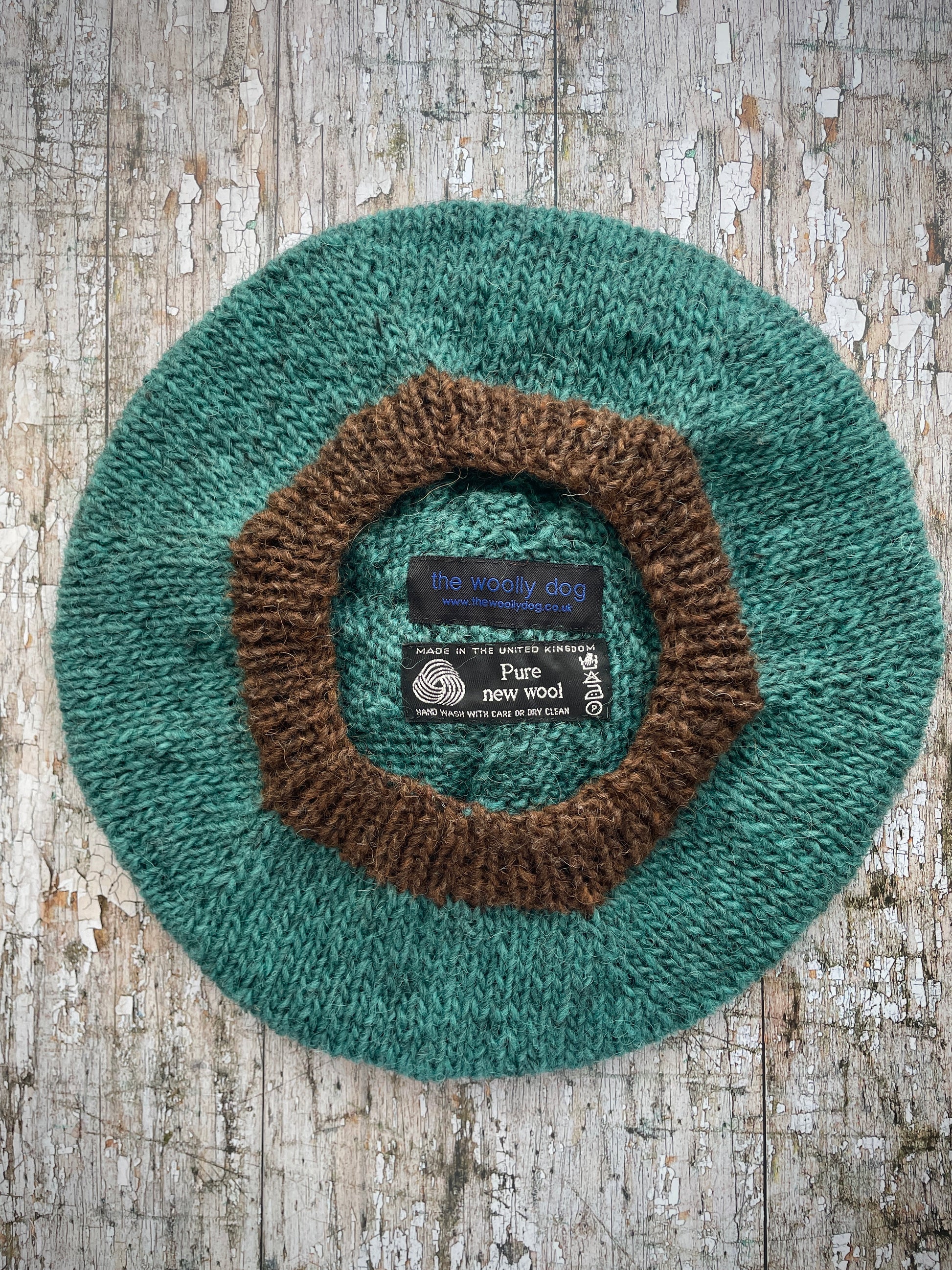 Hand Knitted Wool Beret Viridian + Dark Chocolate Brown

Beautifully hand knitted beret in Icelandic pure wool, perfect for keeping your head warm on cold days. Knitted in a lovely viridian colour with a dark chocolate brown pom and ribbed band that gives the hat a snug fit.

SIZE: adult.

DIAMETER: 11+1/4" / 28.5cm.

CARE: hand wash or machine wash on wool cycle at 30 degrees, dry flat, do not tumble dry.