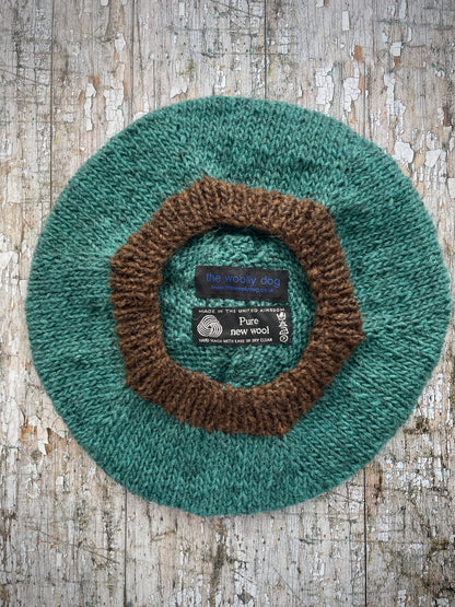 Hand Knitted Wool Beret Viridian + Dark Chocolate Brown

Beautifully hand knitted beret in Icelandic pure wool, perfect for keeping your head warm on cold days. Knitted in a lovely viridian colour with a dark chocolate brown pom and ribbed band that gives the hat a snug fit.

SIZE: adult.

DIAMETER: 11+1/4" / 28.5cm.

CARE: hand wash or machine wash on wool cycle at 30 degrees, dry flat, do not tumble dry.