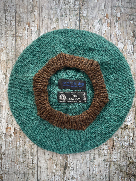 Hand Knitted Wool Beret Viridian + Dark Chocolate Brown

Beautifully hand knitted beret in Icelandic pure wool, perfect for keeping your head warm on cold days. Knitted in a lovely viridian colour with a dark chocolate brown pom and ribbed band that gives the hat a snug fit.

SIZE: adult.

DIAMETER: 11+1/4" / 28.5cm.

CARE: hand wash or machine wash on wool cycle at 30 degrees, dry flat, do not tumble dry.