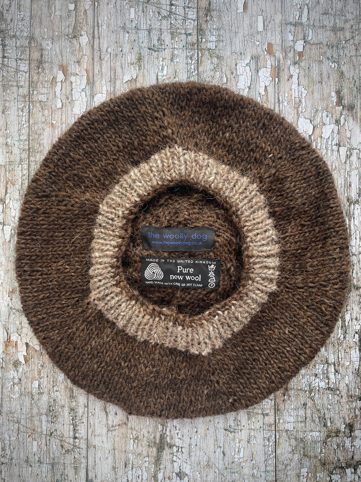 Hand Knitted Wool Beret Dark Chocolate + Dark Oat

Beautifully hand knitted beret in Icelandic pure wool, perfect for keeping your head warm on cold days. Knitted in a lovely dark chocolate brown colour with a dark oat pom and ribbed band that gives the hat a snug fit.

SIZE: adult.

DIAMETER: 11+1/2" / 29cm.

CARE: hand wash or machine wash on wool cycle at 30 degrees, dry flat, do not tumble dry.