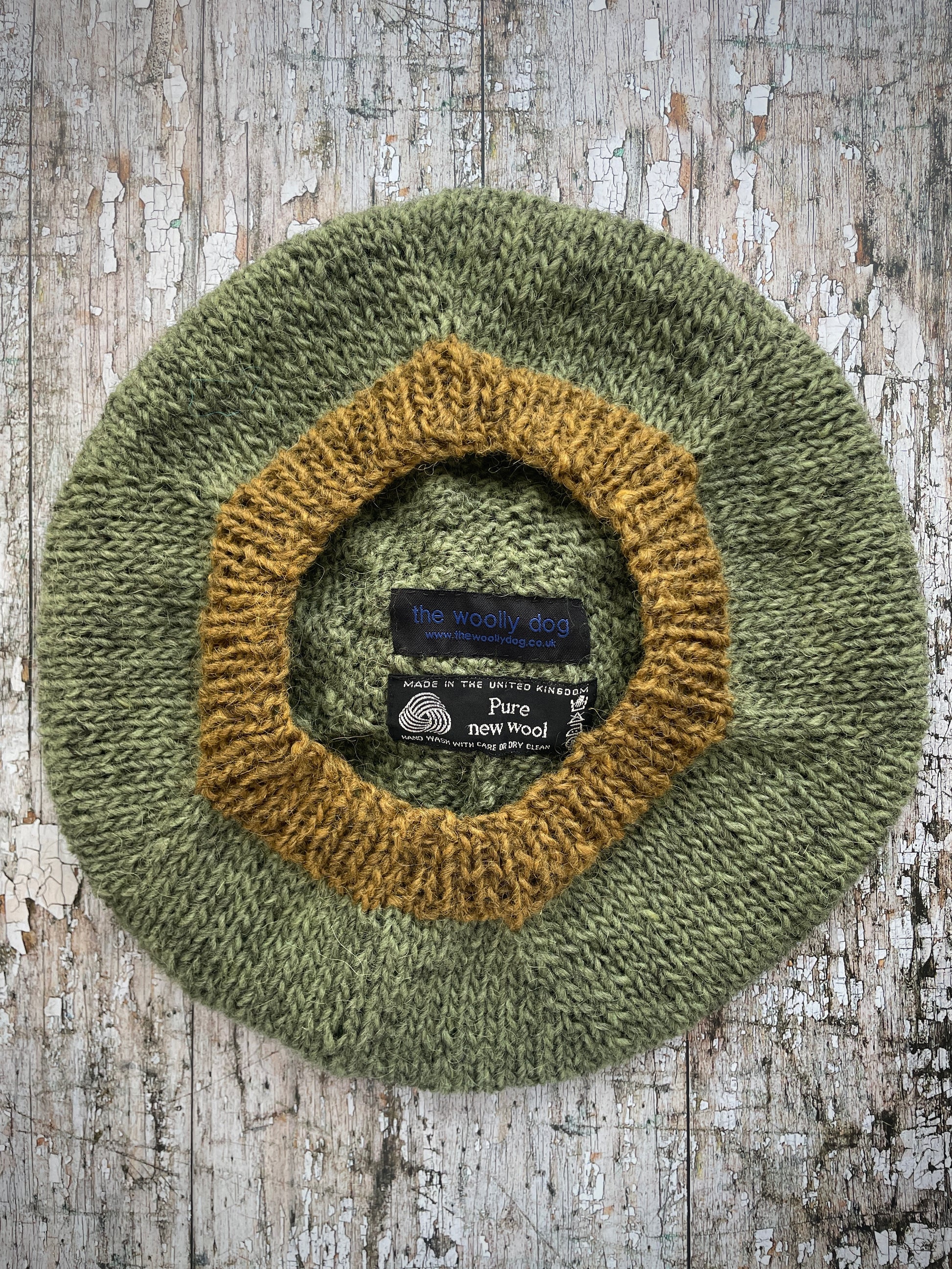 Hand Knitted Wool Beret Olive + Dark Kelp

Beautifully hand knitted beret in Icelandic pure wool, perfect for keeping your head warm on cold days, knitted in olive with a dark kelp colour pom and ribbed band that gives the hat a snug fit.

SIZE: adult.

DIAMETER: 11+1/2" / 29.5 cm.

CARE: hand wash or machine wash on wool cycle at 30 degrees, dry flat, do not tumble dry.