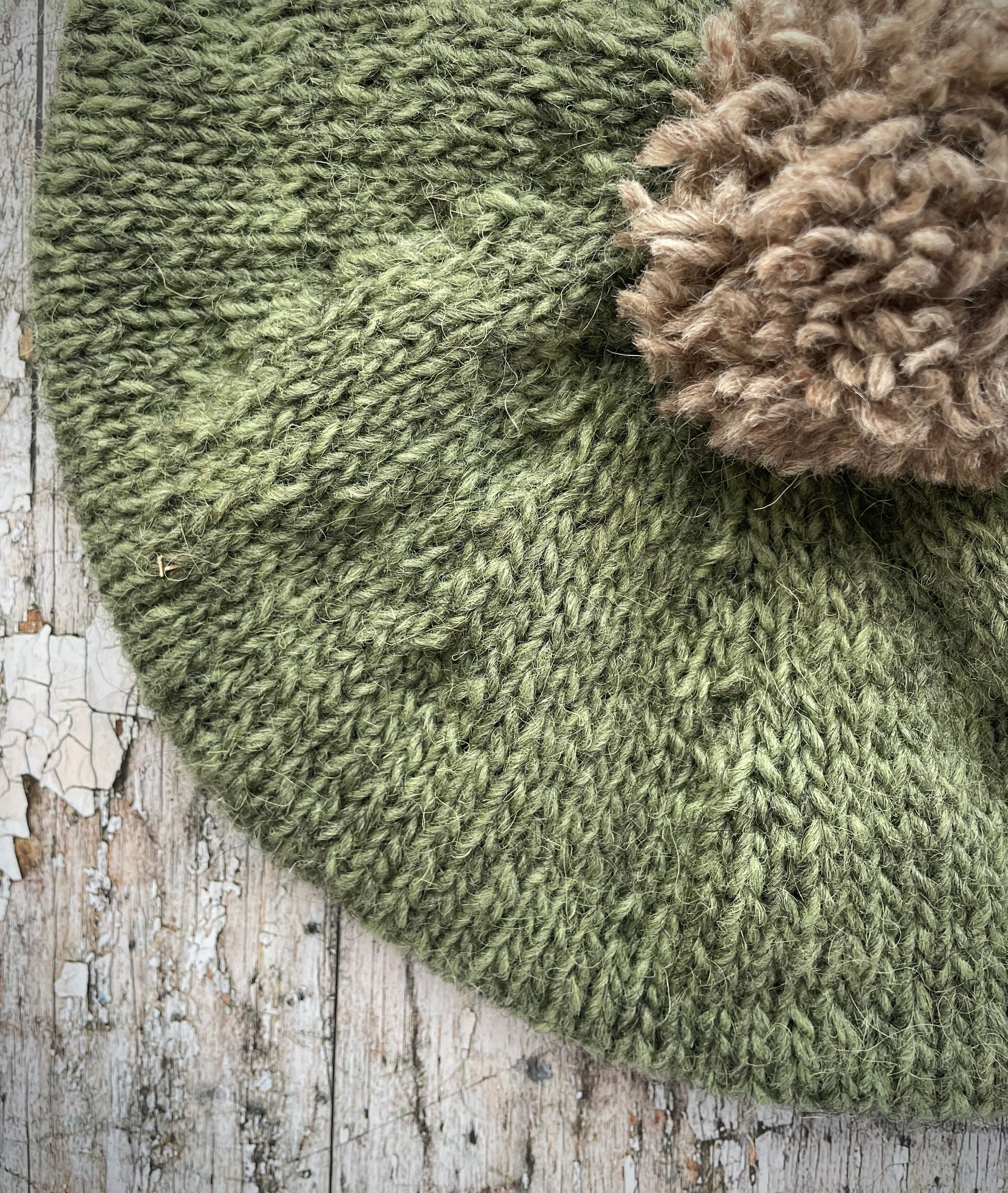 Hand Knitted Wool Beret Olive + Dark Oat

Beautifully hand knitted beret in Icelandic pure wool, perfect for keeping your head warm on cold days, knitted in olive with a dark oat colour pom and ribbed band that gives the hat a snug fit.

SIZE: adult.

DIAMETER: 11" / 28 cm.

CARE: hand wash or machine wash on wool cycle at 30 degrees, dry flat, do not tumble dry.