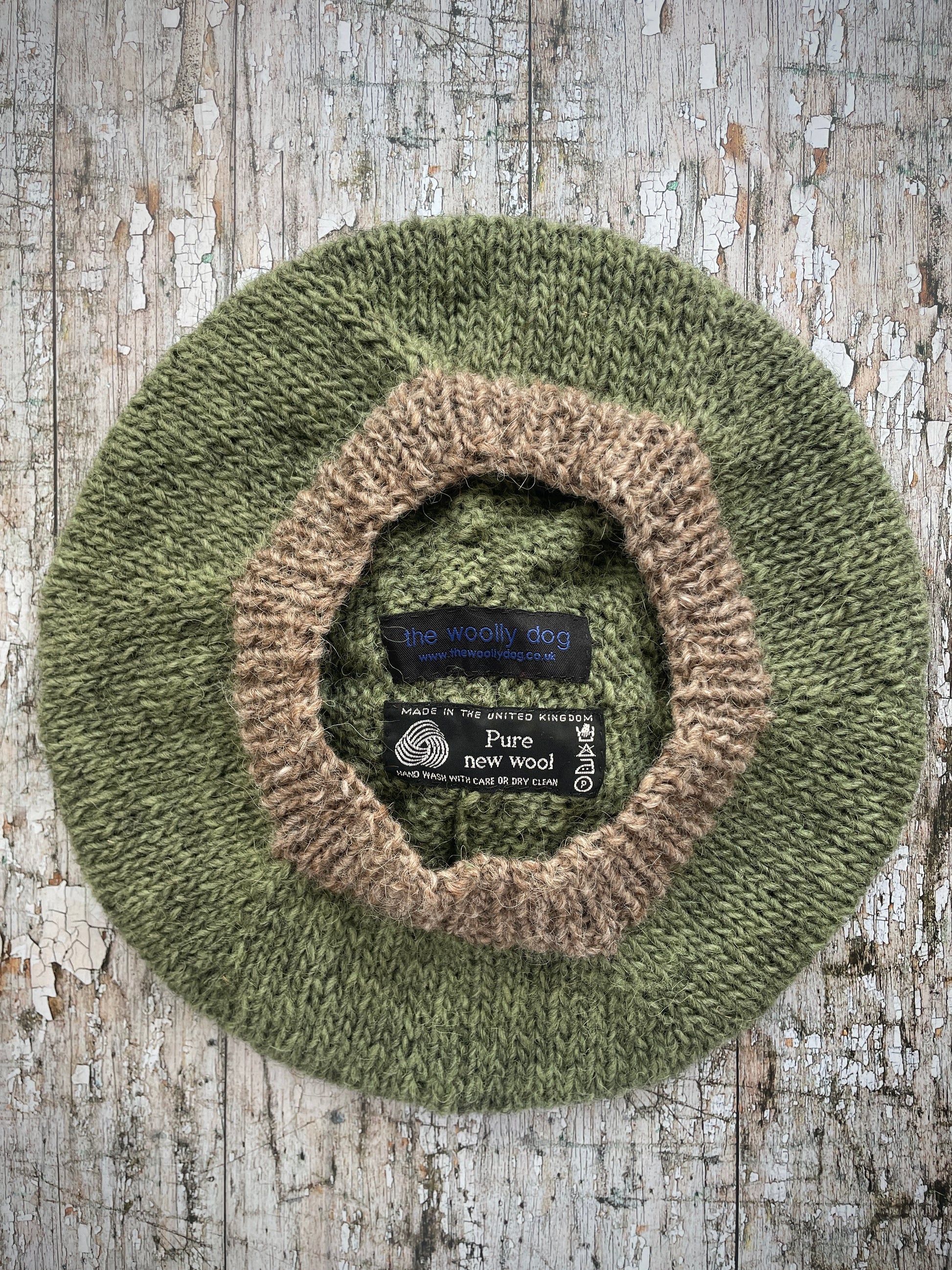 Hand Knitted Wool Beret Olive + Dark Oat

Beautifully hand knitted beret in Icelandic pure wool, perfect for keeping your head warm on cold days, knitted in olive with a dark oat colour pom and ribbed band that gives the hat a snug fit.

SIZE: adult.

DIAMETER: 11" / 28 cm.

CARE: hand wash or machine wash on wool cycle at 30 degrees, dry flat, do not tumble dry.