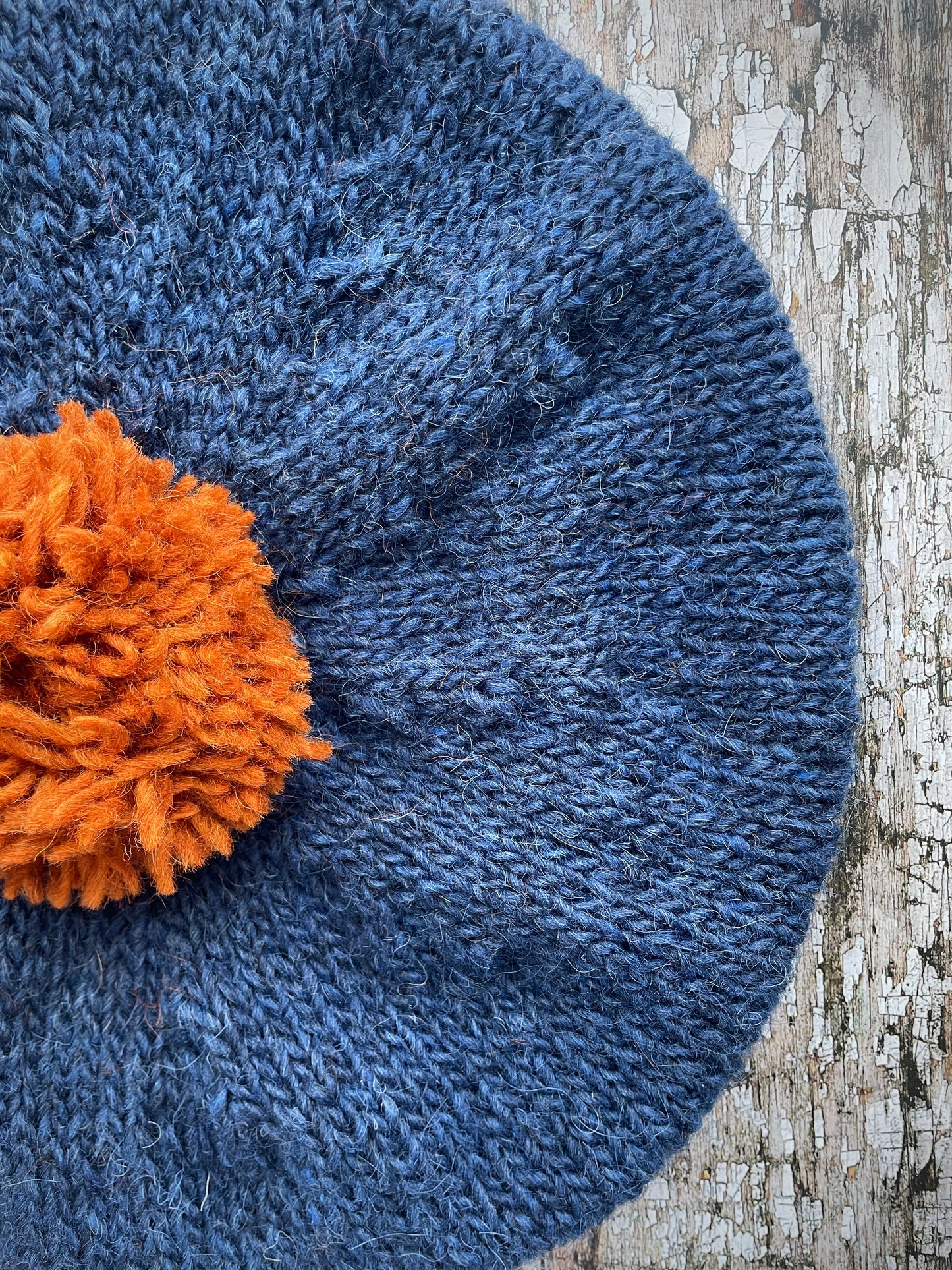 Hand Knitted Wool Beret Indigo Blue + Burnt Orange

Beautifully hand knitted beret in Icelandic pure wool, perfect for keeping your head warm on cold days, knitted in indigo with a burnt orange colour pom and ribbed band that gives the hat a snug fit.

SIZE: adult.

DIAMETER: 11+1/4" / 28 cm.

CARE: hand wash or machine wash on wool cycle at 30 degrees, dry flat, do not tumble dry.