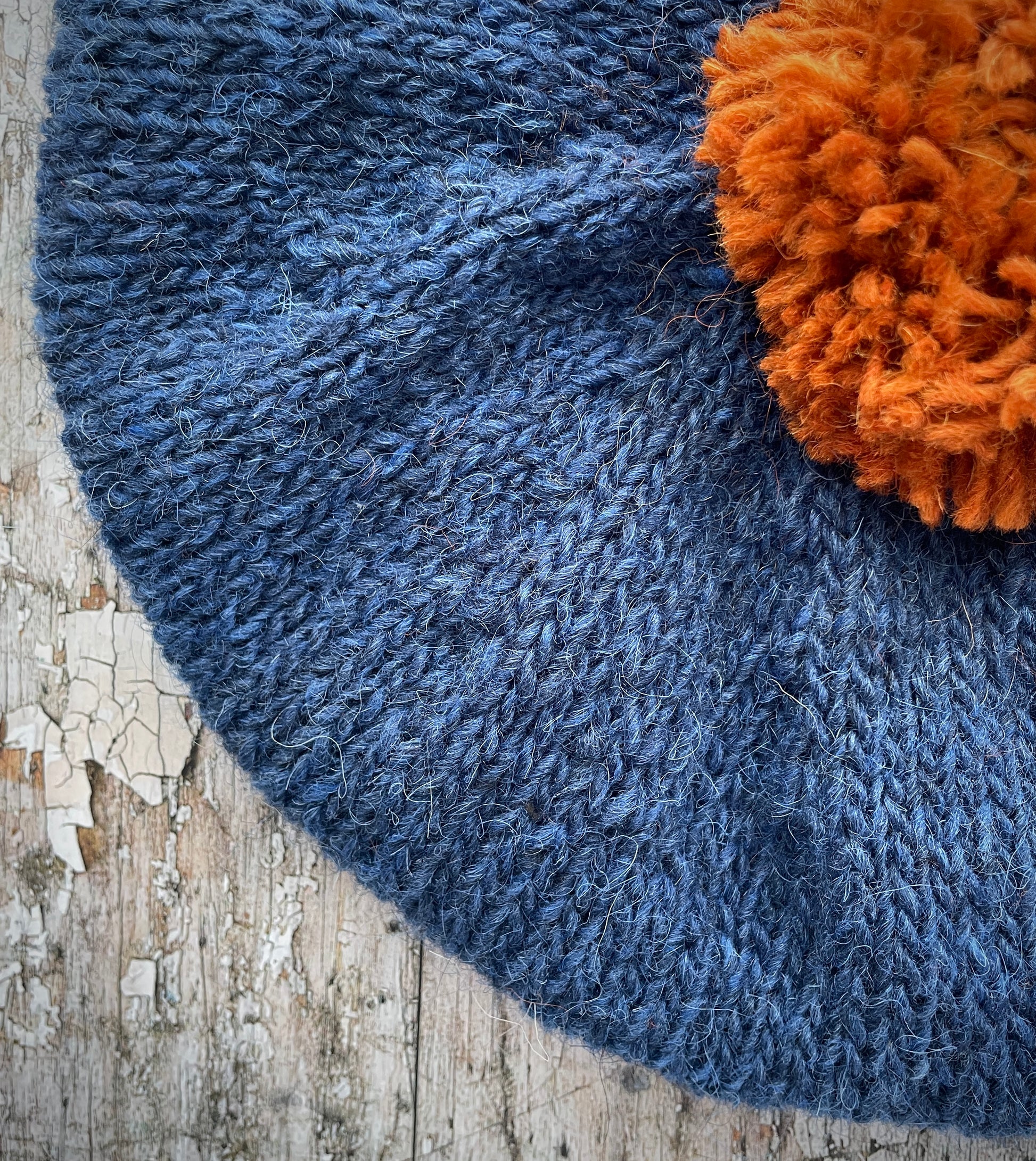 Hand Knitted Wool Beret Indigo Blue + Burnt Orange

Beautifully hand knitted beret in Icelandic pure wool, perfect for keeping your head warm on cold days, knitted in indigo with a burnt orange colour pom and ribbed band that gives the hat a snug fit.

SIZE: adult.

DIAMETER: 11+1/4" / 28 cm.

CARE: hand wash or machine wash on wool cycle at 30 degrees, dry flat, do not tumble dry.