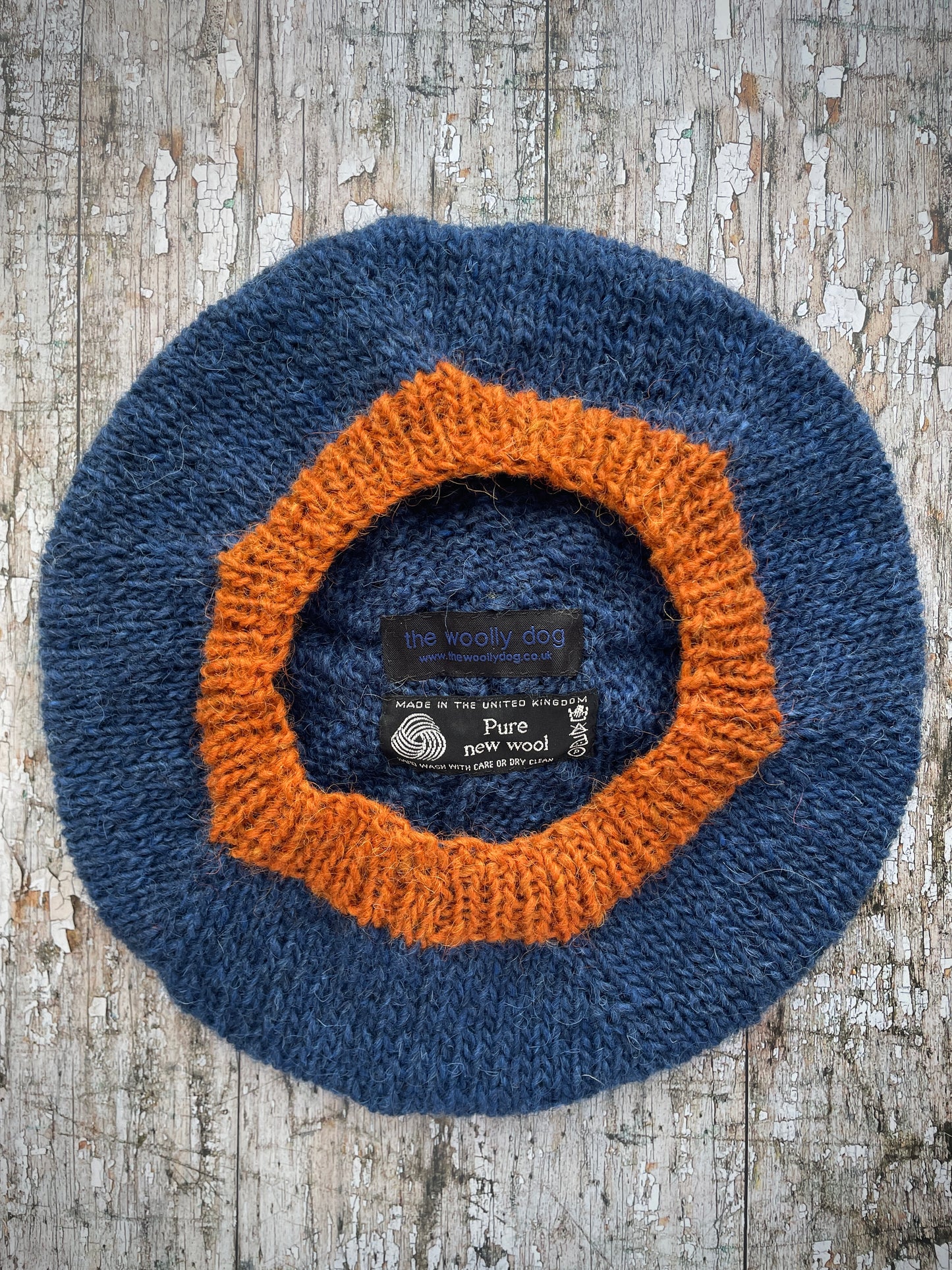 Hand Knitted Wool Beret Indigo Blue + Burnt Orange

Beautifully hand knitted beret in Icelandic pure wool, perfect for keeping your head warm on cold days, knitted in indigo with a burnt orange colour pom and ribbed band that gives the hat a snug fit.

SIZE: adult.

DIAMETER: 11+1/4" / 28 cm.

CARE: hand wash or machine wash on wool cycle at 30 degrees, dry flat, do not tumble dry.