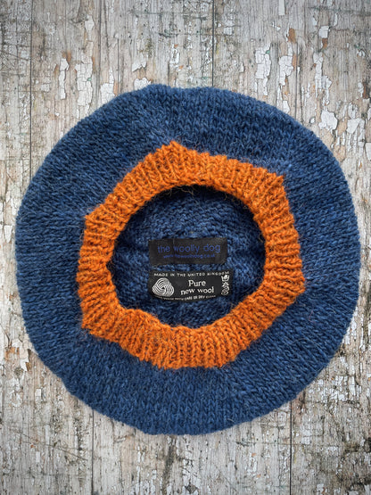 Hand Knitted Wool Beret Indigo Blue + Burnt Orange

Beautifully hand knitted beret in Icelandic pure wool, perfect for keeping your head warm on cold days, knitted in indigo with a burnt orange colour pom and ribbed band that gives the hat a snug fit.

SIZE: adult.

DIAMETER: 11+1/4" / 28 cm.

CARE: hand wash or machine wash on wool cycle at 30 degrees, dry flat, do not tumble dry.