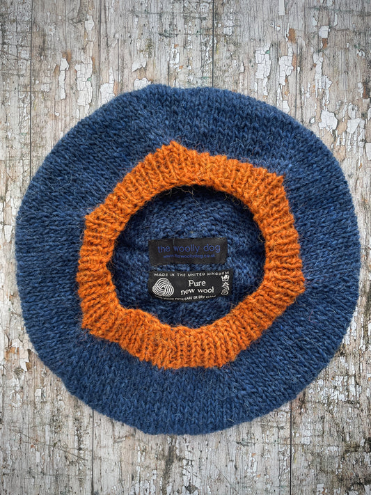 Hand Knitted Wool Beret Indigo Blue + Burnt Orange

Beautifully hand knitted beret in Icelandic pure wool, perfect for keeping your head warm on cold days, knitted in indigo with a burnt orange colour pom and ribbed band that gives the hat a snug fit.

SIZE: adult.

DIAMETER: 11+1/4" / 28 cm.

CARE: hand wash or machine wash on wool cycle at 30 degrees, dry flat, do not tumble dry.