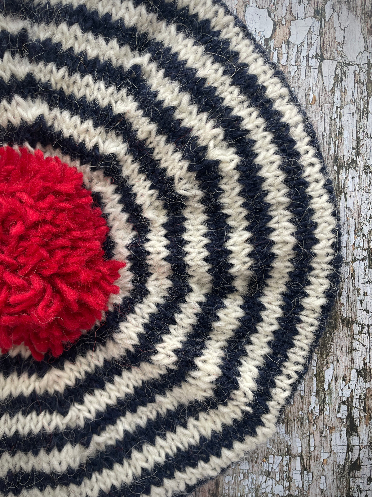 Navy Blue + White + Red Breton Stripes Wool Beret

Nautical style beret, beautifully hand knitted with Icelandic pure new wool, in Breton stripes of navy blue and white, with a big red pom and a navy blue ribbed band that gives the hat a snug fit. Perfect for keeping your head warm on cold days.

SIZE: adult.

DIAMETER: 11+1/2" / 29 cm.

CARE: hand wash or machine wash on wool cycle at 30 degrees, dry flat, do not tumble dry.