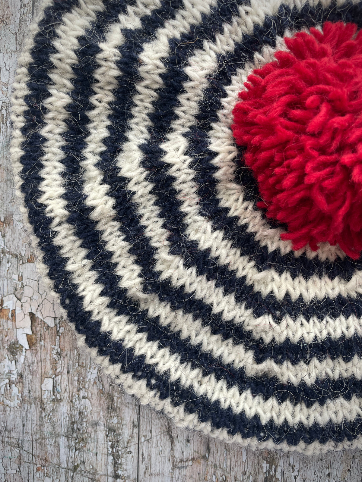 Navy Blue + White + Red Breton Stripes Wool Beret

Nautical style beret, beautifully hand knitted with Icelandic pure new wool, in Breton stripes of navy blue and white, with a big red pom and a navy blue ribbed band that gives the hat a snug fit. Perfect for keeping your head warm on cold days.

SIZE: adult.

DIAMETER: 11+1/2" / 29 cm.

CARE: hand wash or machine wash on wool cycle at 30 degrees, dry flat, do not tumble dry.