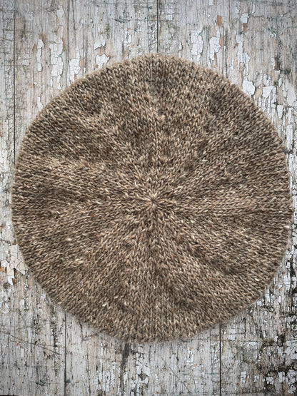 Hand Knitted Wool Beret Dark Oat + Dark Chocolate

Beautifully hand knitted beret in Icelandic pure wool, perfect for keeping your head warm on cold days, knitted in dark oat heather, with a dark chocolate brown ribbed band that gives the hat a snug fit.

SIZE: adult.

DIAMETER: 11+1/4" / 28.5 cm.

CARE: hand wash or machine wash on wool cycle at 30 degrees, dry flat, do not tumble dry.