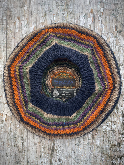 Classic 40's Style Beret no.7
Beautifully hand knitted beret in Icelandic wool, perfect for keeping your head warm on cold days and adding a touch of 40's style to any outfit. Knitted in navy, dark oat, sage, violet heather, dark kelp, burnt burnt orange and milk chocolate brown stripes, with a navy ribbed band that gives the hat a snug fit.

SIZE: adult.

DIAMETER: 11+1/2" / 29cm.

CARE: hand wash or machine wash on wool cycle at 30 degrees, dry flat, do not tumble dry.
