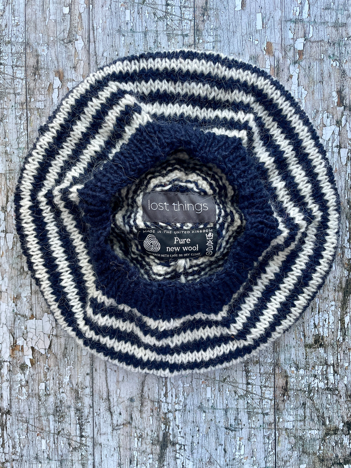 Navy Blue + White + Red Breton Stripes Wool Beret

Nautical style beret, beautifully hand knitted with Icelandic pure new wool, in Breton stripes of navy blue and white, with a big red pom and a navy blue ribbed band that gives the hat a snug fit. Perfect for keeping your head warm on cold days.

SIZE: adult.

DIAMETER: 11+1/2" / 29 cm.

CARE: hand wash or machine wash on wool cycle at 30 degrees, dry flat, do not tumble dry.