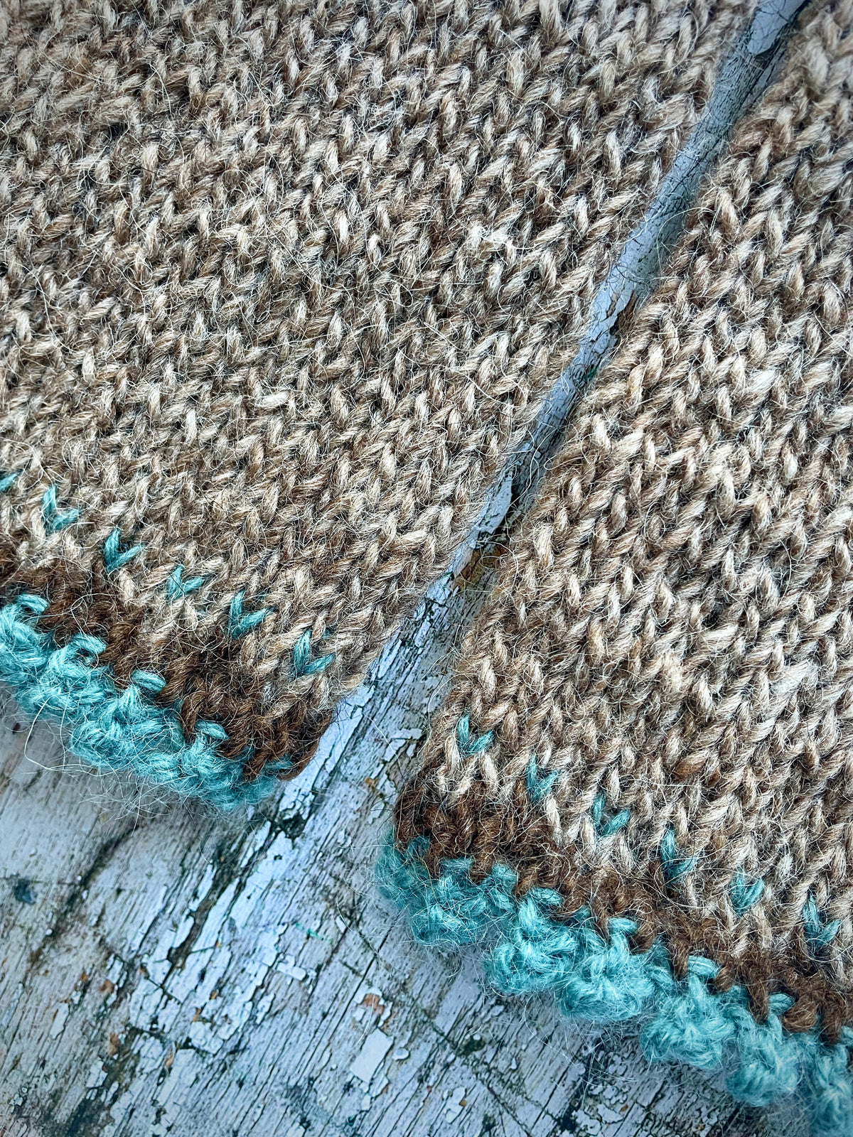 Hand Knitted Wool Wrist warmers

These wrist warmers have been beautifully hand knitted in dark oak and dark chocolate brown Icelandic wool, with a pretty, picot edging of soft pale teal lambswool and kid mohair to add a romantic touch to your outfit. Perfect for keeping your arms and hands warm on cold days while allowing your fingers to be free.

SIZE: adult.


LENGTH: 9+1/4" / 23.5cm.


WIDTH: 4+1/4" / 10.5cm.