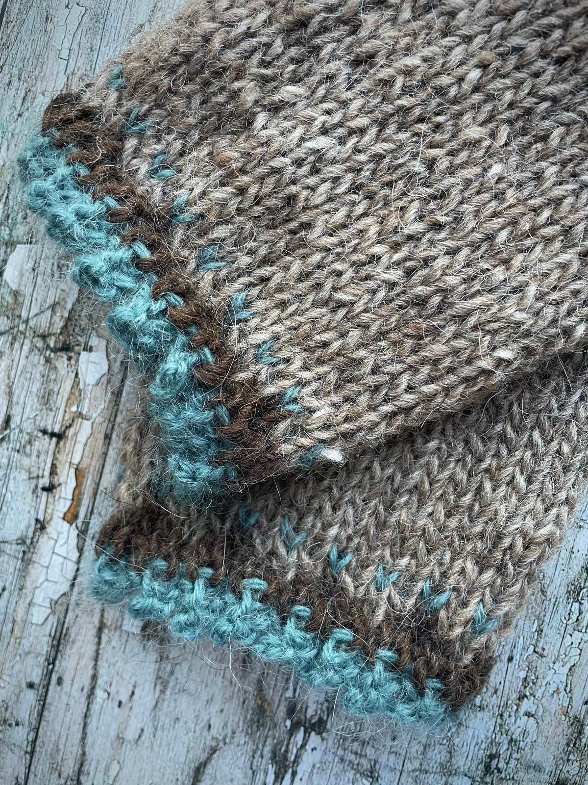 Hand Knitted Wool Wrist warmers

These wrist warmers have been beautifully hand knitted in dark oak and dark chocolate brown Icelandic wool, with a pretty, picot edging of soft pale teal lambswool and kid mohair to add a romantic touch to your outfit. Perfect for keeping your arms and hands warm on cold days while allowing your fingers to be free.

SIZE: adult.


LENGTH: 9+1/4" / 23.5cm.


WIDTH: 4+1/4" / 10.5cm.