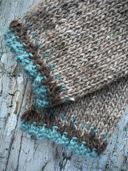 Hand Knitted Wool Wrist warmers

These wrist warmers have been beautifully hand knitted in dark oak and dark chocolate brown Icelandic wool, with a pretty, picot edging of soft pale teal lambswool and kid mohair to add a romantic touch to your outfit. Perfect for keeping your arms and hands warm on cold days while allowing your fingers to be free.

SIZE: adult.


LENGTH: 9+1/4" / 23.5cm.


WIDTH: 4+1/4" / 10.5cm.