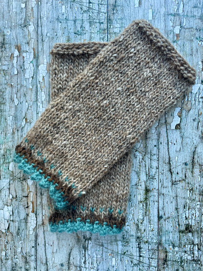 Hand Knitted Wool Wrist warmers

These wrist warmers have been beautifully hand knitted in dark oak and dark chocolate brown Icelandic wool, with a pretty, picot edging of soft pale teal lambswool and kid mohair to add a romantic touch to your outfit. Perfect for keeping your arms and hands warm on cold days while allowing your fingers to be free.

SIZE: adult.


LENGTH: 9+1/4" / 23.5cm.


WIDTH: 4+1/4" / 10.5cm.