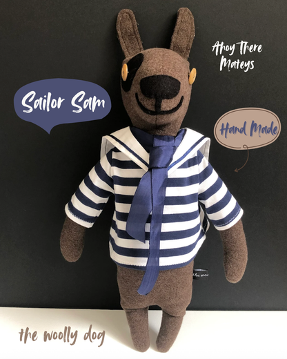 Sailor Sam Woolly Dog

Each woolly dog character I make is one of a kind with their own personality. Sam the sailor has been beautifully handmade with chocolate brown pure new wool and wears a removable blue and white stripe cotton sailor top with collar and blue tie.
Sam is filled with a non-allergenic soft toy filling conforming to BS + CE standards for hygiene + fire safety, which makes him firm and able to stand propped against a wall as a lovely nursery decoration.
NOT SUITABLE FOR CHILDREN UNDER 3