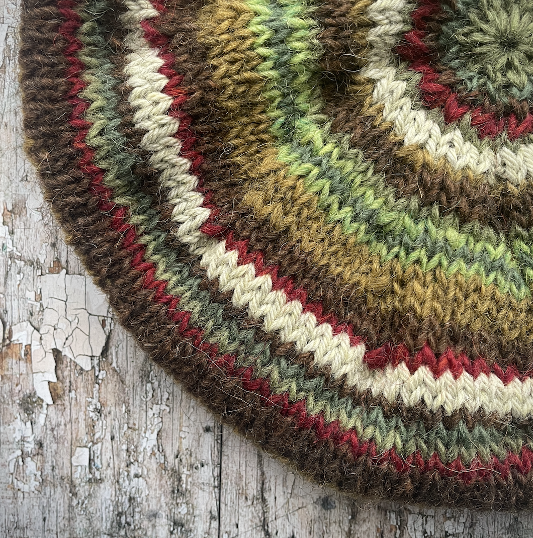 CLASSIC 40's STYLE ADULT'S BERET style 21

Beautifully hand knitted beret in Icelandic pure wool, perfect for keeping your head warm on cold days and adding a touch of 40's style to any outfit. Knitted in dark kelp, pebble, dark chocolate, green, sage green heather, garnet and frostbite stripes, with a dark kelp ribbed band that gives the hat a snug fit.

ONE SIZE: adult.
CARE: hand wash or machine wash on wool cycle at 30 degrees, dry flat, do not tumble dry.