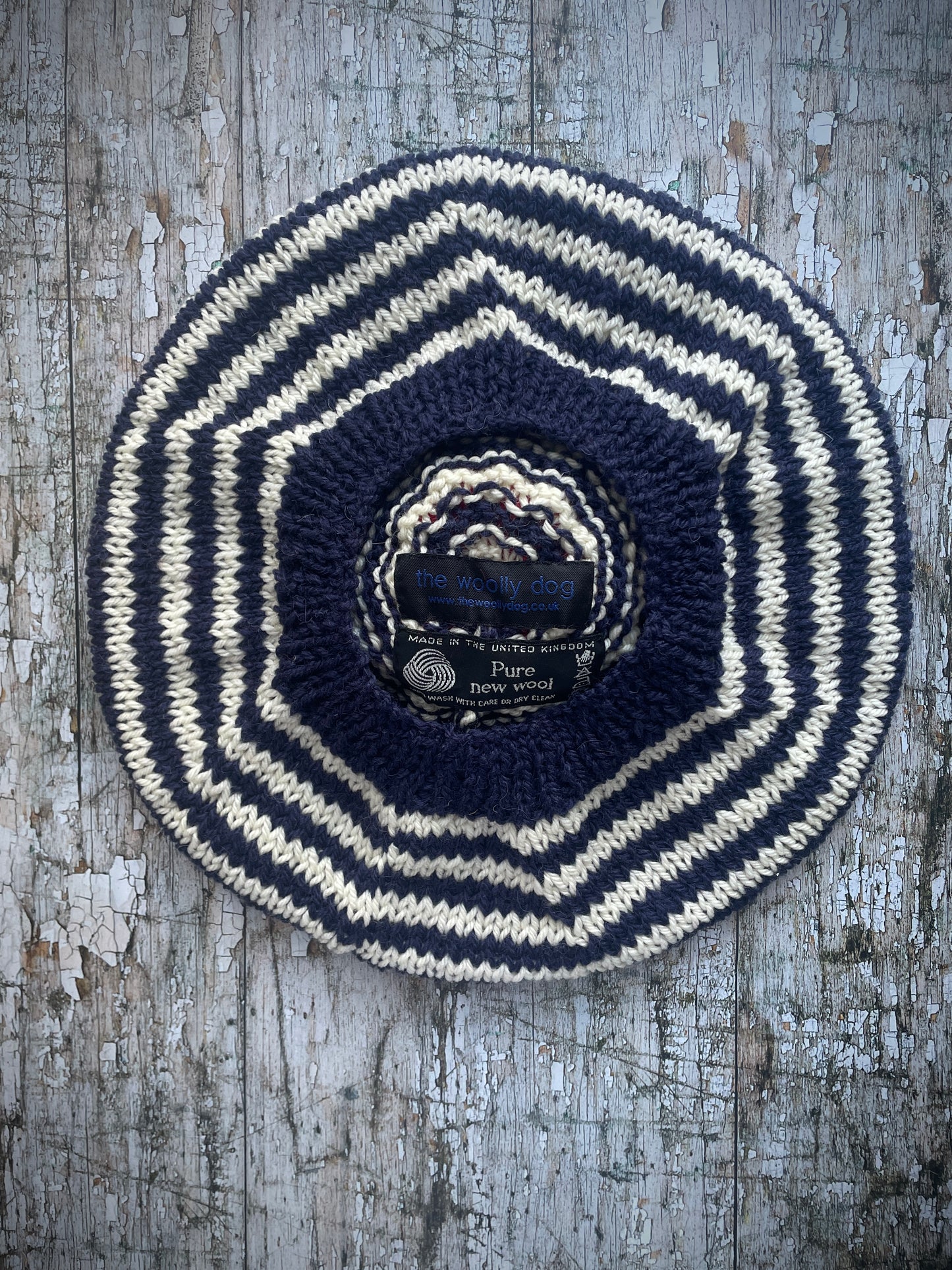 Children's Breton Stripe Beret 6 - 18 Months

This nautical style beret, has been beautifully hand knitted with Rowan pure new wool in navy blue and cream stripes. It has a big red pom and a navy blue ribbed band that gives the hat a snug fit. Perfect for keeping little heads warm on cold days and would look stunning on boys or girls.
SIZE: child 6 - 18 months, Diameter: 24cm / 10+1/2".