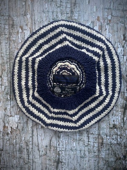 Children's Breton Stripe Beret 6 - 18 Months

This nautical style beret, has been beautifully hand knitted with Rowan pure new wool in navy blue and cream stripes. It has a big red pom and a navy blue ribbed band that gives the hat a snug fit. Perfect for keeping little heads warm on cold days and would look stunning on boys or girls.
SIZE: child 6 - 18 months, Diameter: 24cm / 10+1/2".